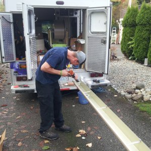 forming a seamless gutter on our Sammamish gutters truck